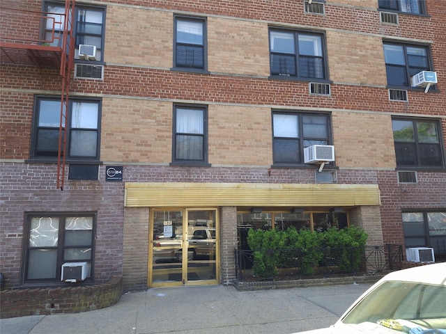 880 68th St Unit 1J, Brooklyn, NY 11220 - view of apartment building / complex featuring cooling unit