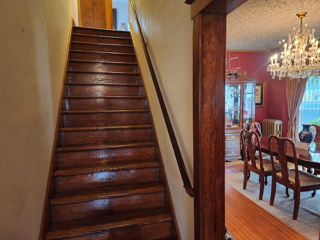 30 Royce Ave, Middletown, NY 10940 - stairs with radiator, a chandelier, and a textured ceiling
