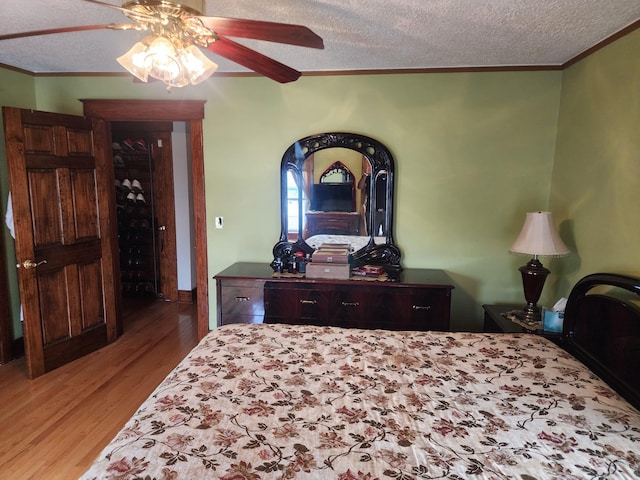 30 Royce Ave, Middletown, NY 10940 - bedroom with crown molding, wood finished floors, a textured ceiling, and ceiling fan