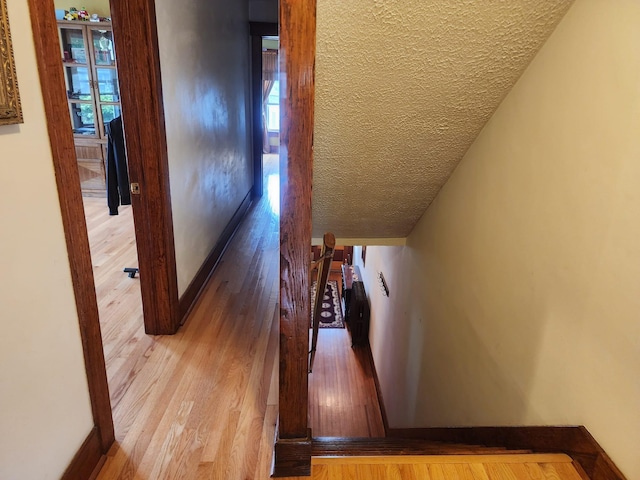 30 Royce Ave, Middletown, NY 10940 - corridor with a textured ceiling, wood finished floors, and baseboards