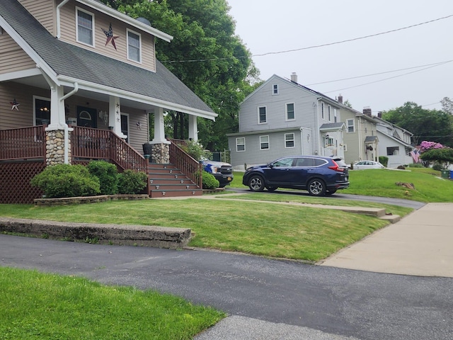 30 Royce Ave, Middletown, NY 10940 - view of front of house featuring a shingled roof, covered porch, a front yard, and stairs