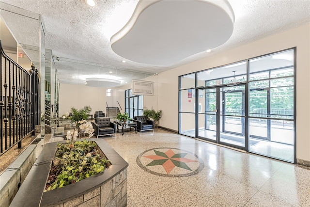 277 Bronx River Rd Unit 2A, Yonkers, NY 10704 - lobby featuring a textured ceiling and recessed lighting
