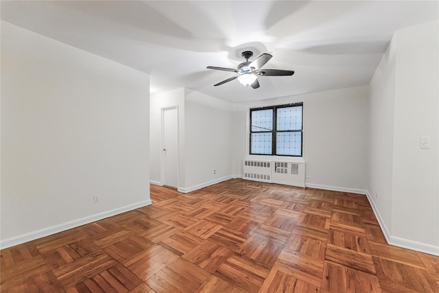 277 Bronx River Rd Unit 2A, Yonkers, NY 10704 - empty room featuring radiator heating unit and a ceiling fan