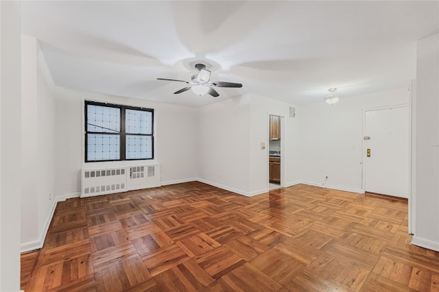 277 Bronx River Rd Unit 2A, Yonkers, NY 10704 - unfurnished room with radiator heating unit and a ceiling fan