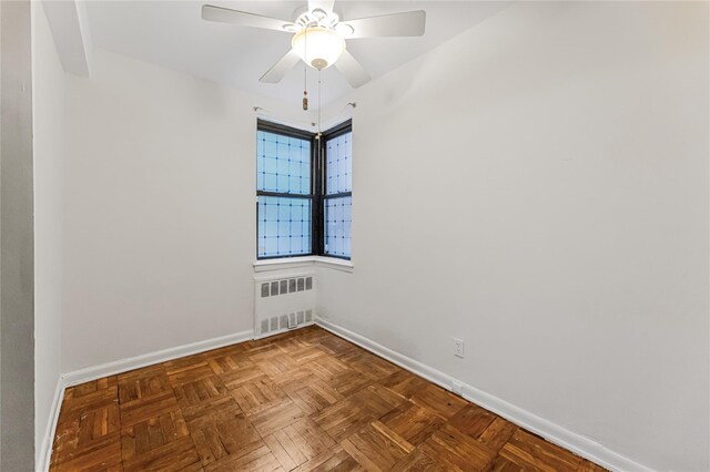 277 Bronx River Rd Unit 2A, Yonkers, NY 10704 - unfurnished room featuring radiator and ceiling fan
