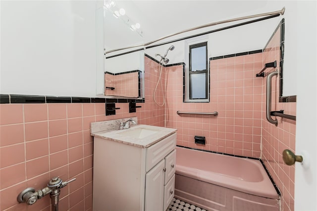 277 Bronx River Rd Unit 2A, Yonkers, NY 10704 - full bathroom with tile walls, vanity, and bathing tub / shower combination