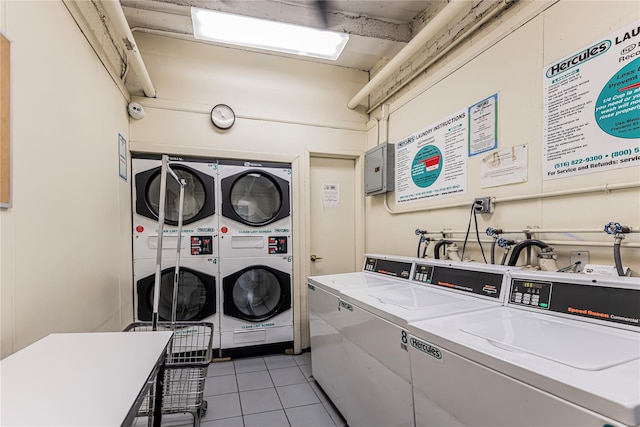 277 Bronx River Rd Unit 2A, Yonkers, NY 10704 - shared laundry with stacked washer and clothes dryer, washing machine and clothes dryer, and light tile patterned floors