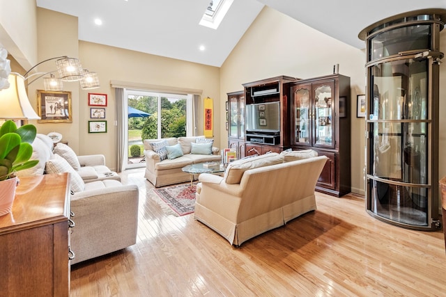 8 Lakeview Ct, Riverhead, NY 11901 - living room with a skylight, high vaulted ceiling, and light wood-type flooring