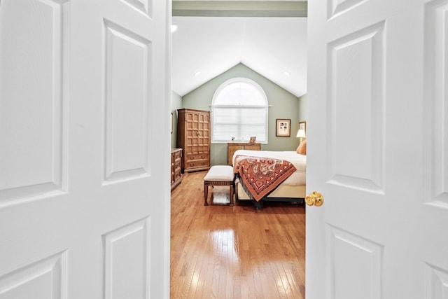 8 Lakeview Ct, Riverhead, NY 11901 - bedroom featuring wood-type flooring and lofted ceiling