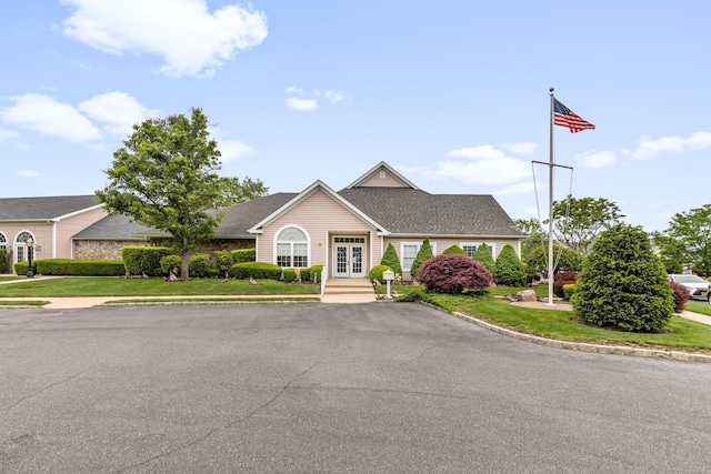 8 Lakeview Ct, Riverhead, NY 11901 - view of front of house with french doors, a front yard, and a shingled roof