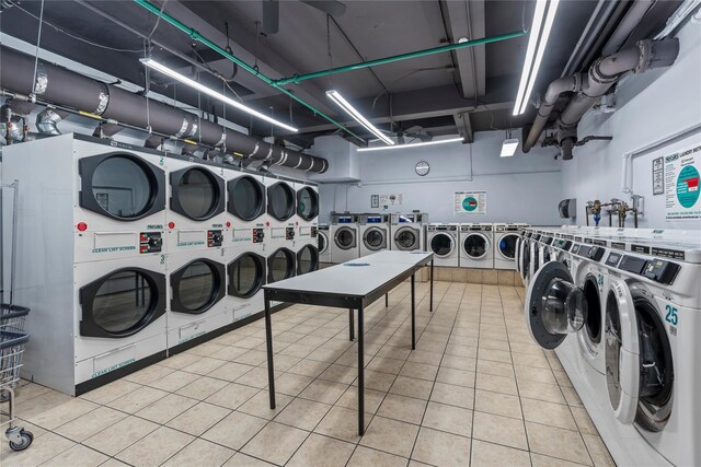 310 Riverside Dr Unit 1509, New York Manhattan, NY 10025 - community laundry room featuring washing machine and dryer, tile patterned floors, and stacked washer / dryer