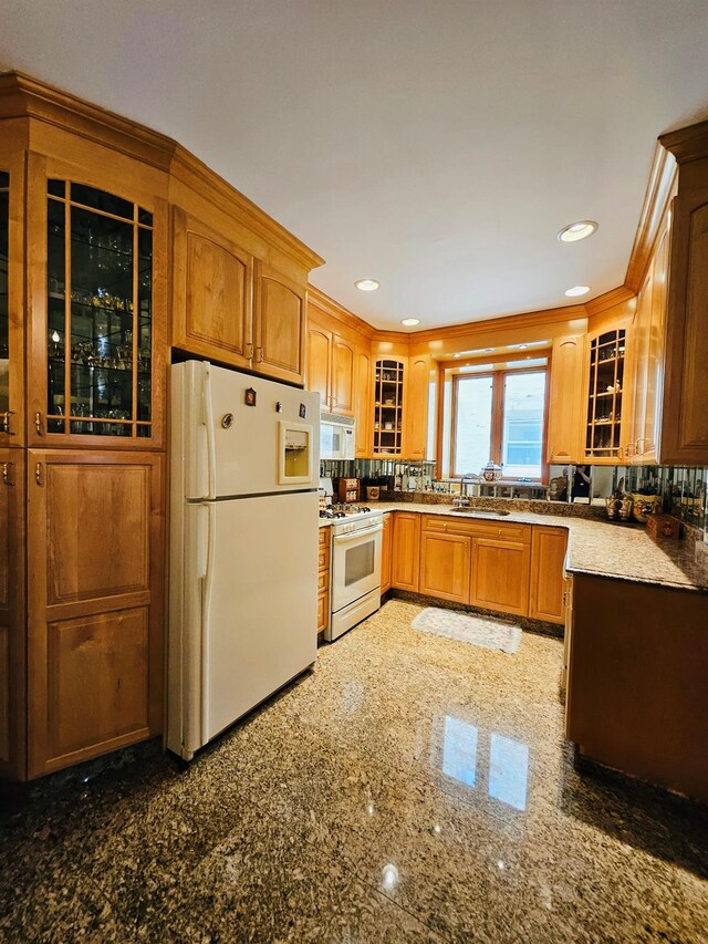 1725 W 4th St, Brooklyn, NY 11223 - kitchen with white appliances, glass insert cabinets, a sink, brown cabinetry, and recessed lighting