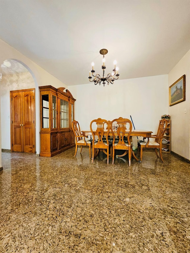 1725 W 4th St, Brooklyn, NY 11223 - dining room featuring arched walkways, a chandelier, and granite tiled floors