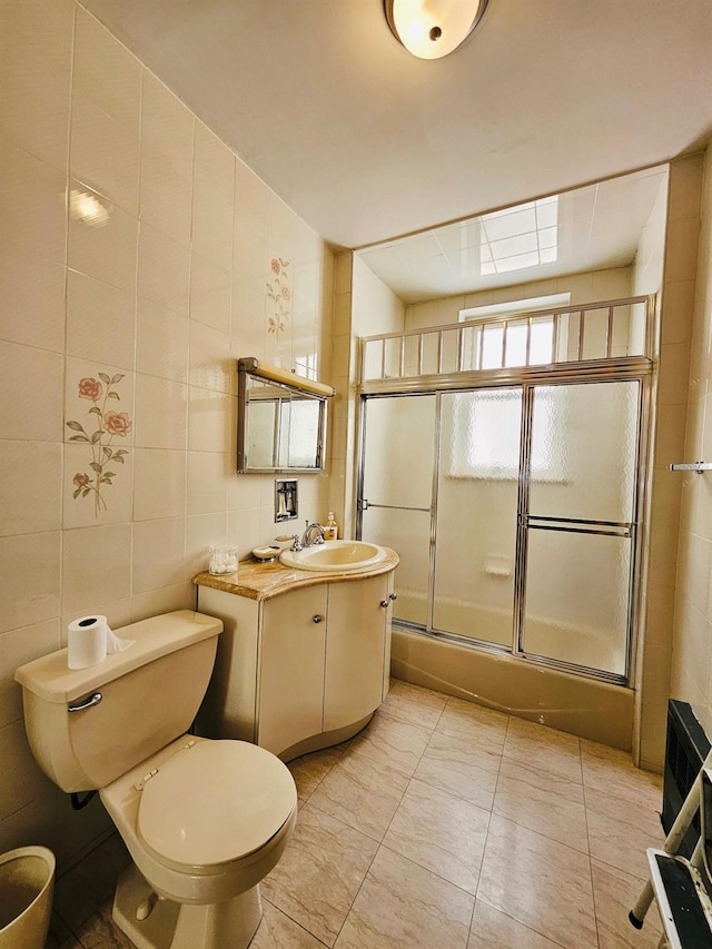 1725 W 4th St, Brooklyn, NY 11223 - bathroom featuring vanity, toilet, tile walls, and tile patterned floors