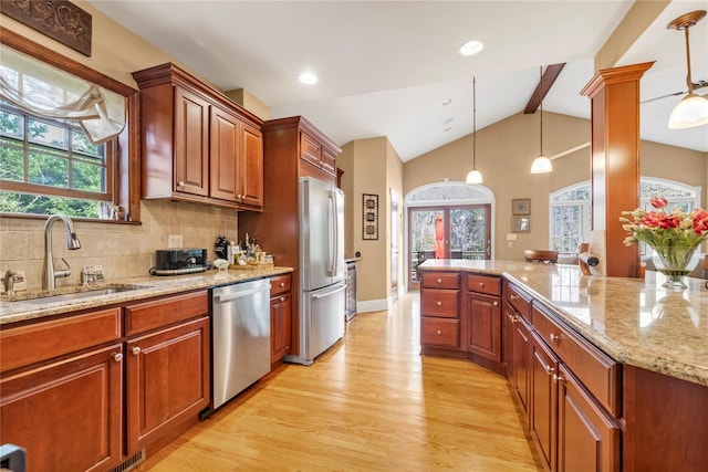 45 Henry St, Merrick, NY 11566 - kitchen with stainless steel appliances, a sink, healthy amount of natural light, light wood finished floors, and recessed lighting
