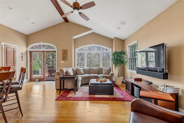 45 Henry St, Merrick, NY 11566 - living room featuring light wood-style floors, ceiling fan, high vaulted ceiling, beamed ceiling, and baseboards