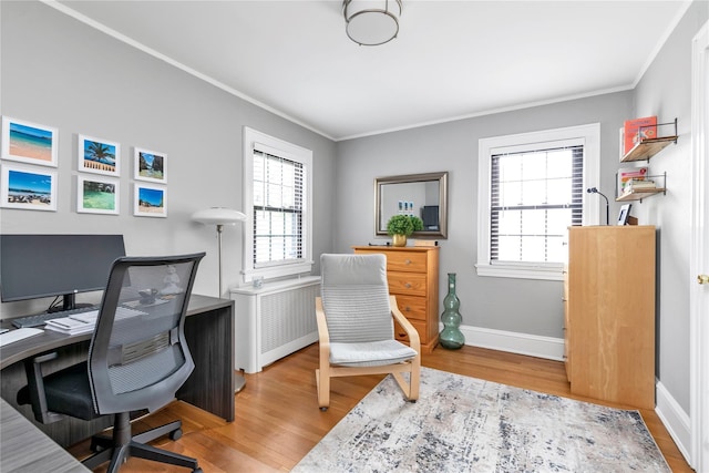 45 Henry St, Merrick, NY 11566 - home office with wood finished floors, crown molding, baseboards, and radiator