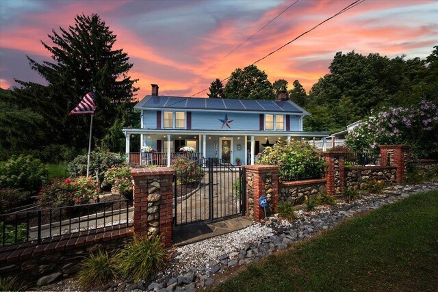 278 Gibson Hill Rd, Chester, NY 10918 - farmhouse-style home with covered porch, a chimney, and a gate