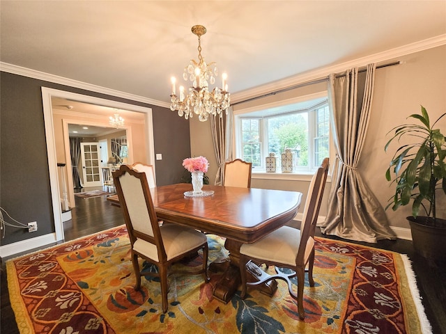 352 Mill Spring Rd, Manhasset, NY 11030 - dining room with a chandelier, crown molding, baseboards, and dark wood-type flooring