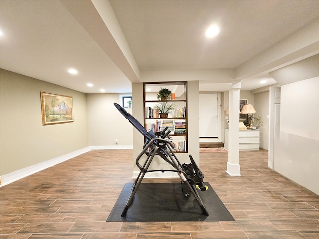 352 Mill Spring Rd, Manhasset, NY 11030 - workout area with recessed lighting, wood finished floors, and baseboards