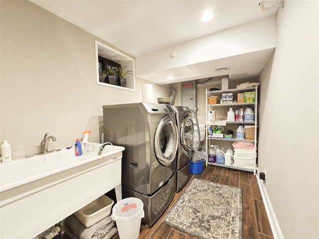 352 Mill Spring Rd, Manhasset, NY 11030 - laundry room with washing machine and dryer, wood tiled floors, baseboards, and recessed lighting
