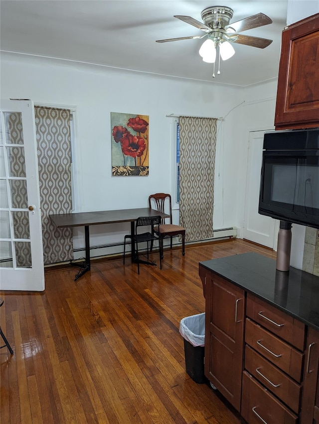 3317 87th St, Jackson Heights, NY 11372 - dining room with ceiling fan and dark wood-style floors