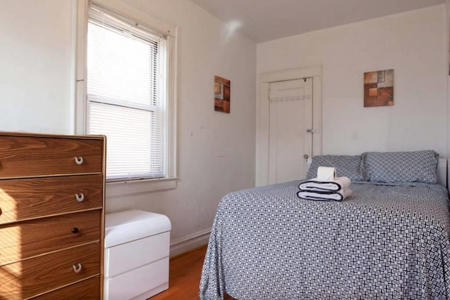 3317 87th St, Jackson Heights, NY 11372 - bedroom with baseboards and light wood-style flooring