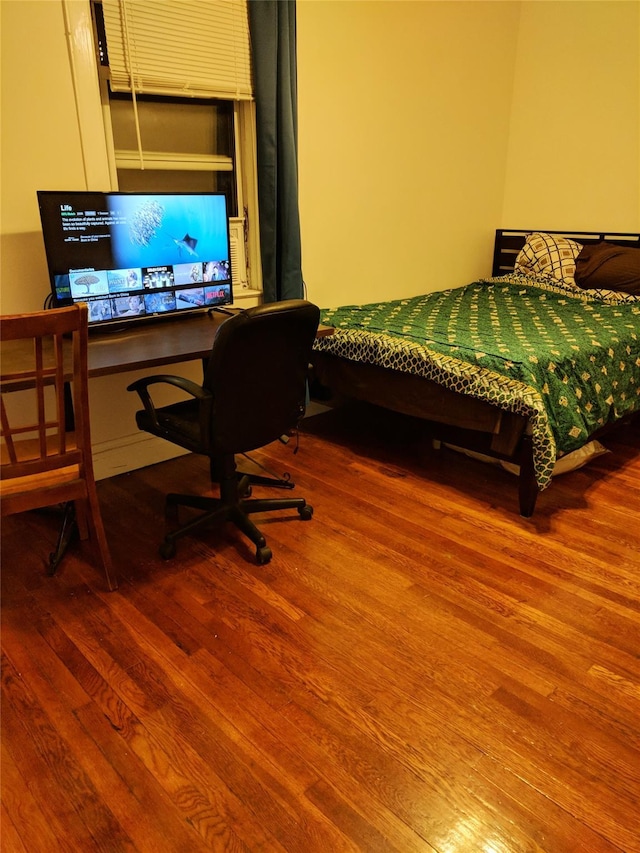 3317 87th St, Jackson Heights, NY 11372 - bedroom with wood finished floors and a desk