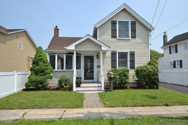 187 Smith Ave, Islip, NY 11751 - traditional-style home featuring a chimney