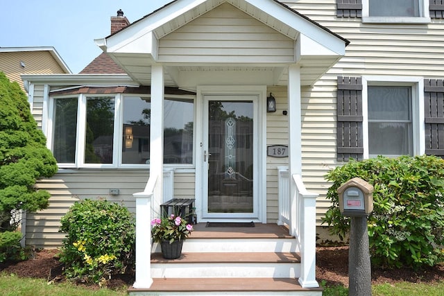 187 Smith Ave, Islip, NY 11751 - entrance to property with a chimney