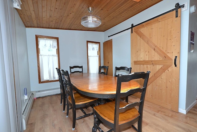 187 Smith Ave, Islip, NY 11751 - dining room featuring a barn door, a baseboard radiator, baseboard heating, light wood finished floors, and wood ceiling