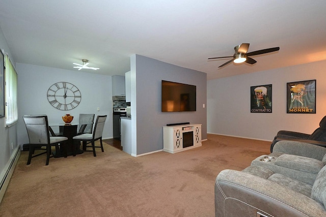 2449 Union Blvd # 39B, Islip, NY 11751 - carpeted living room featuring a baseboard heating unit and ceiling fan