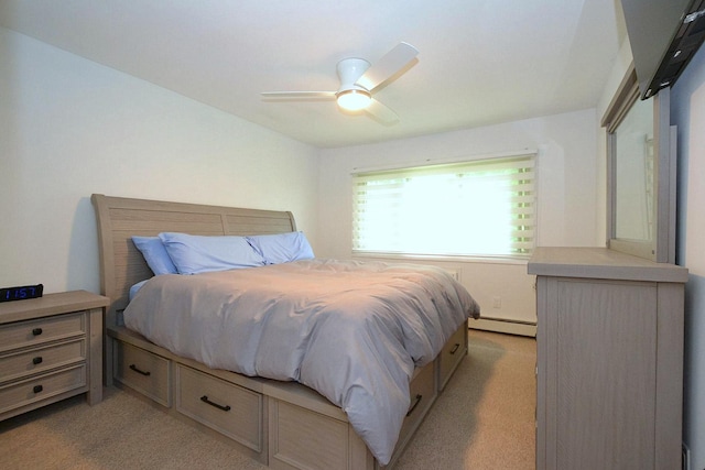2449 Union Blvd # 39B, Islip, NY 11751 - bedroom with light colored carpet, baseboard heating, and ceiling fan