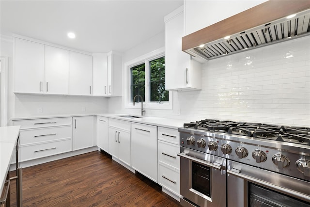 45 Fenimore Rd, New Rochelle, NY 10804 - kitchen featuring double oven range, premium range hood, decorative backsplash, light countertops, and white cabinetry