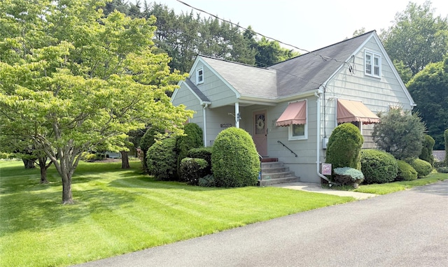 18 Hughes St, Congers, NY 10920 - bungalow featuring a front yard and a shingled roof