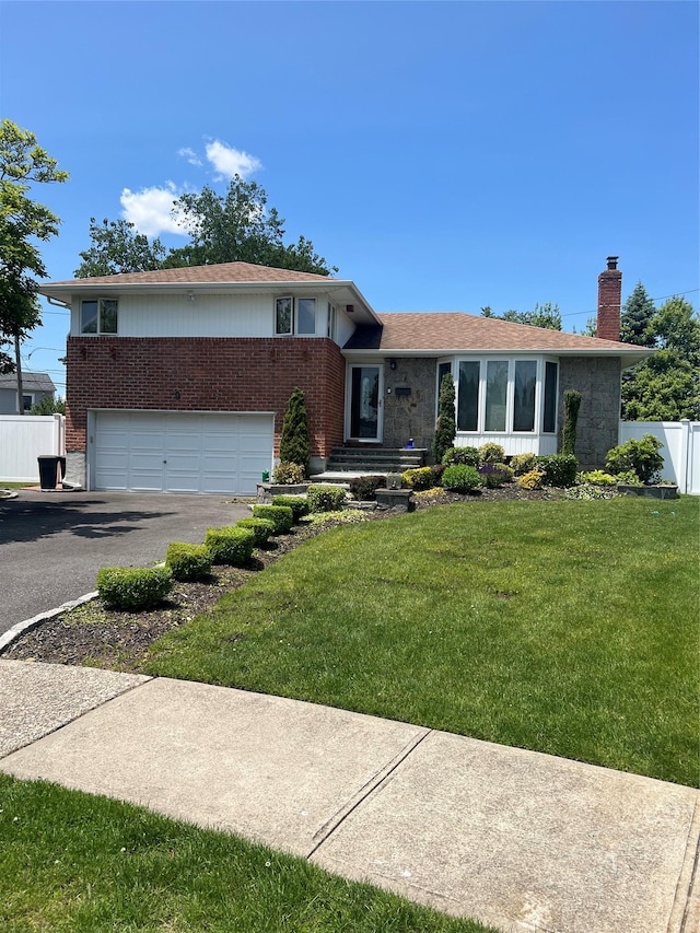 9 Bart Ct, Plainview, NY 11803 - split level home with a chimney, driveway, brick siding, and a garage