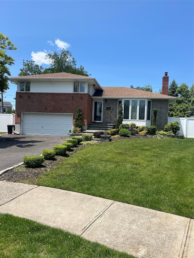 9 Bart Ct, Plainview, NY 11803 - split level home featuring a chimney, brick siding, asphalt driveway, and an attached garage