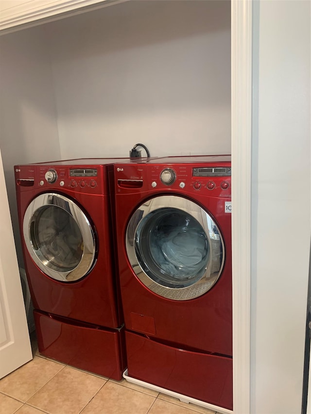 304 Warburton Ave Unit 3A, Yonkers, NY 10701 - washroom with tile patterned floors and washer and dryer