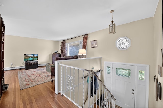 57 Panorama Dr, Patterson, NY 12563 - entrance foyer with a baseboard heating unit, wood finished floors, and a baseboard radiator