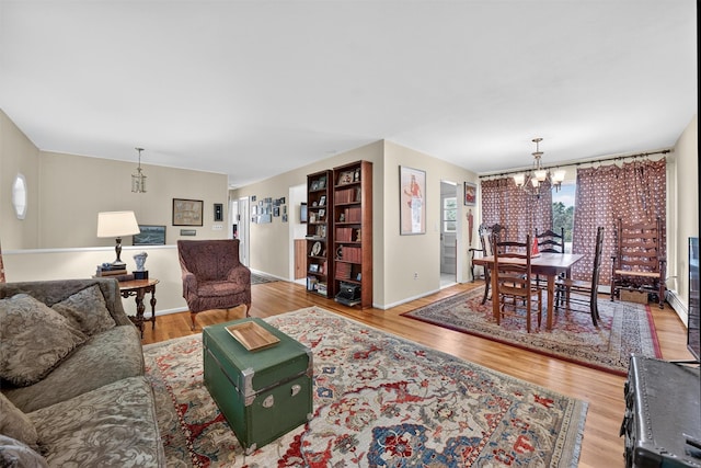 57 Panorama Dr, Patterson, NY 12563 - living area with a chandelier and wood finished floors
