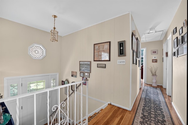 57 Panorama Dr, Patterson, NY 12563 - hall with wood finished floors, an upstairs landing, and attic access