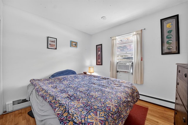57 Panorama Dr, Patterson, NY 12563 - bedroom with a baseboard radiator, baseboard heating, wood finished floors, and cooling unit
