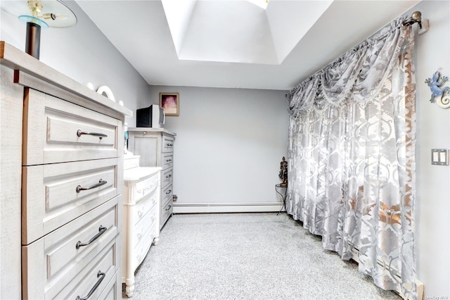 338 Cold Spring Rd, Syosset, NY 11791 - unfurnished bedroom featuring a baseboard heating unit and carpet