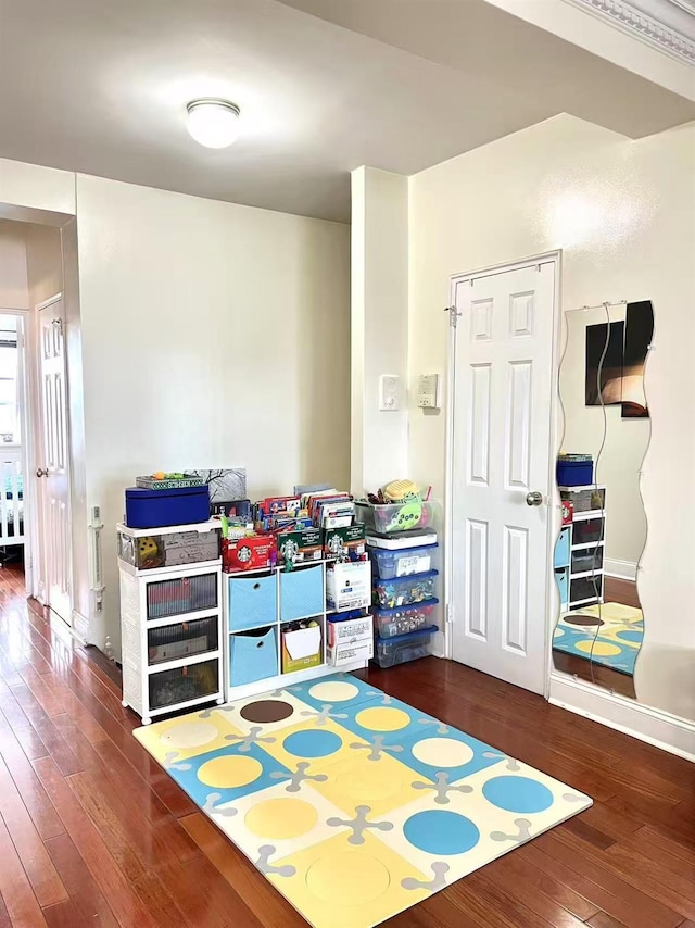 99-05 63rd Dr Unit 14R, Rego Park, NY 11374 - playroom with hardwood / wood-style flooring and baseboards