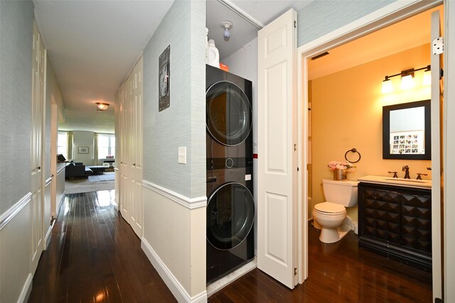 206-05 Emily Rd Unit 6U, Bayside, NY 11360 - washroom featuring stacked washer / drying machine and dark wood-style flooring