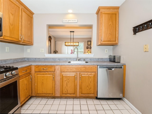 47 Muirfield Ct, Poughkeepsie, NY 12603 - kitchen featuring appliances with stainless steel finishes, a sink, light countertops, and brown cabinetry