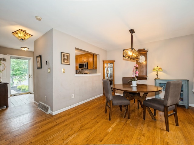 47 Muirfield Ct, Poughkeepsie, NY 12603 - dining space featuring light wood finished floors and baseboards