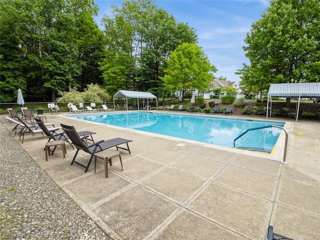 47 Muirfield Ct, Poughkeepsie, NY 12603 - community pool featuring a patio and view of scattered trees