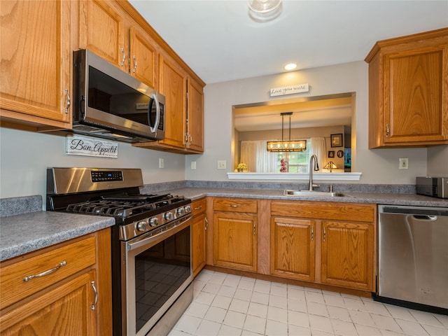 47 Muirfield Ct, Poughkeepsie, NY 12603 - kitchen featuring stainless steel appliances, brown cabinetry, light tile patterned floors, and recessed lighting