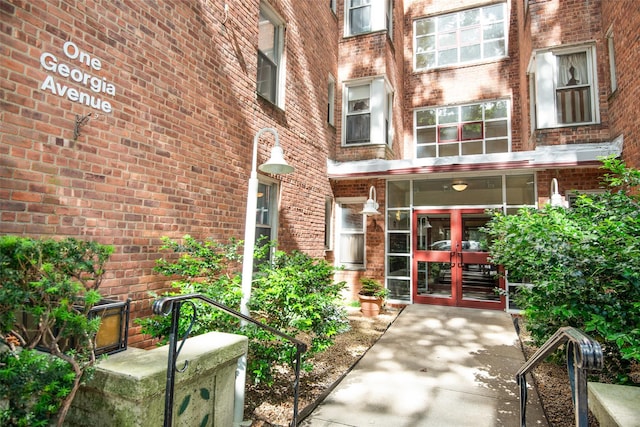 1 Georgia Ave Unit 5A, Bronxville, NY 10708 - doorway to property featuring french doors and brick siding